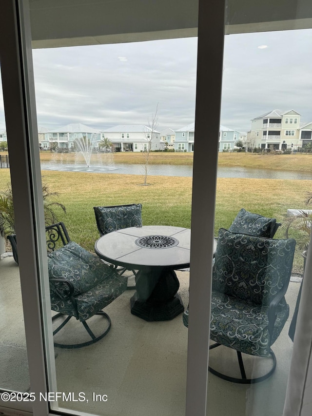 view of patio with a water view