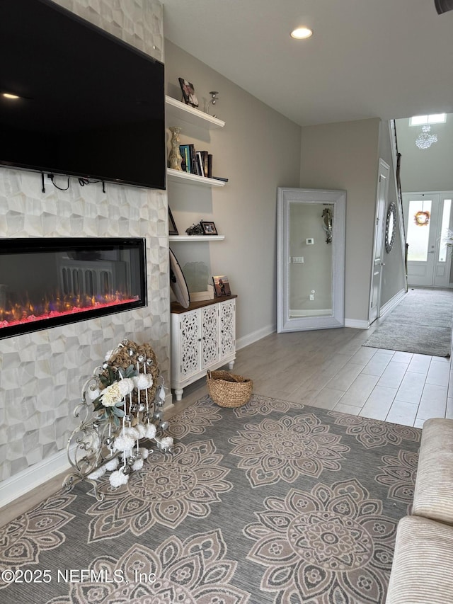 living room with tile patterned floors and a fireplace