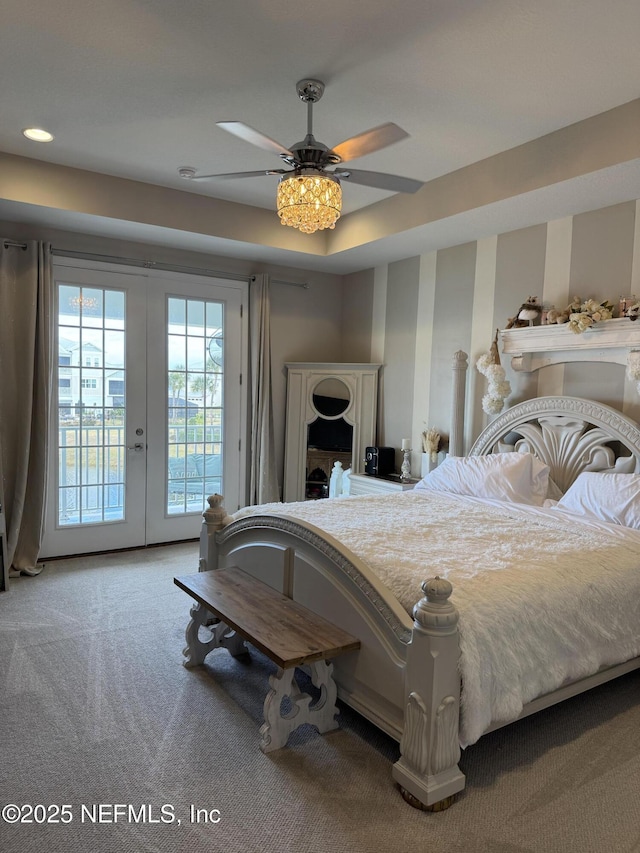 carpeted bedroom with ceiling fan, access to outside, and french doors