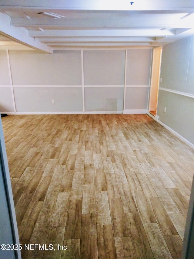 basement featuring light hardwood / wood-style floors