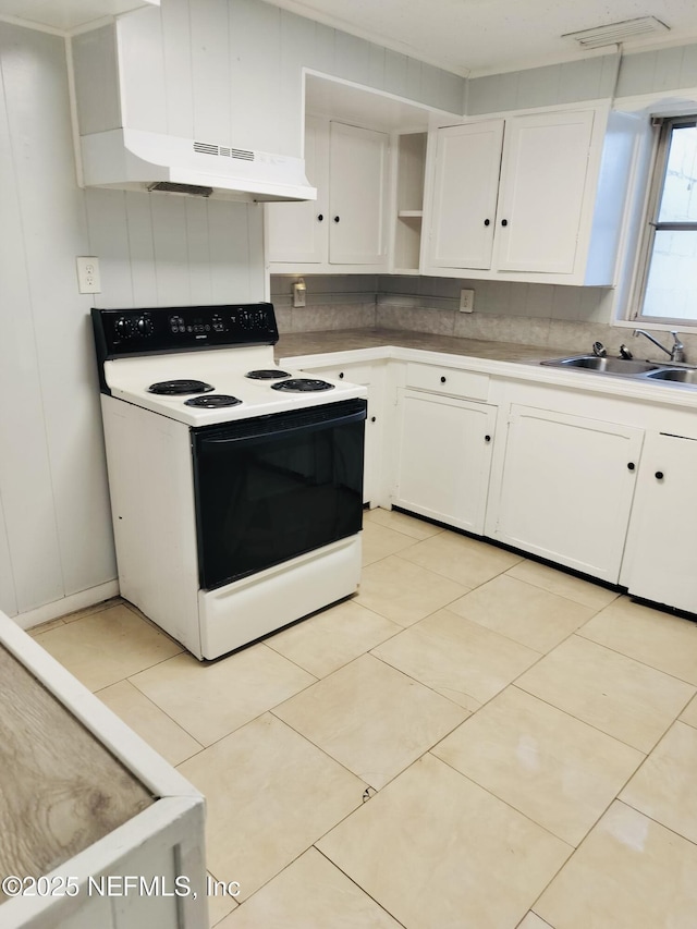 kitchen with range with electric stovetop, sink, white cabinetry, light tile patterned floors, and decorative backsplash