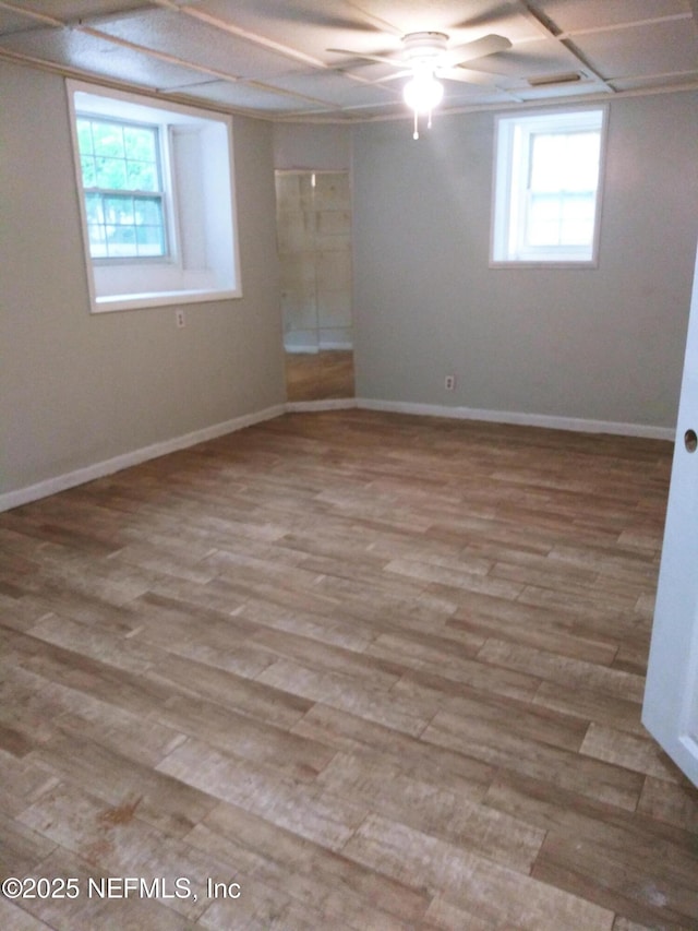 unfurnished room with light hardwood / wood-style floors and a healthy amount of sunlight