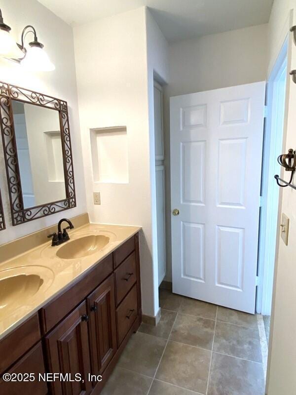 bathroom featuring tile patterned floors and vanity