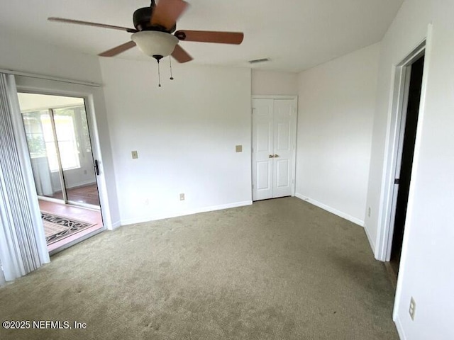 carpeted empty room with ceiling fan