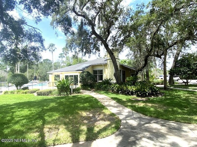 single story home with a front yard