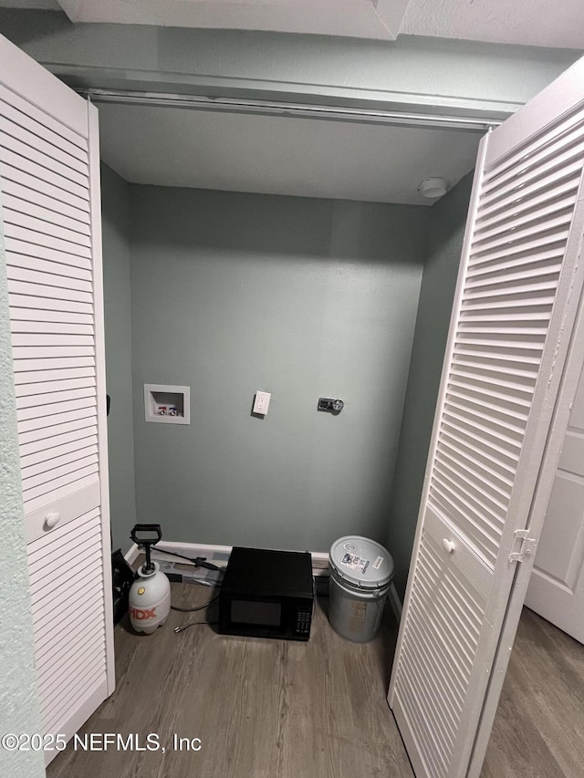 bathroom with wood-type flooring