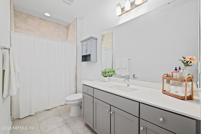 bathroom with vanity, tile patterned floors, toilet, and a shower with curtain