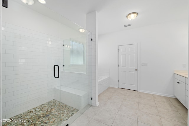 bathroom with visible vents, tile patterned floors, a stall shower, a bath, and vanity