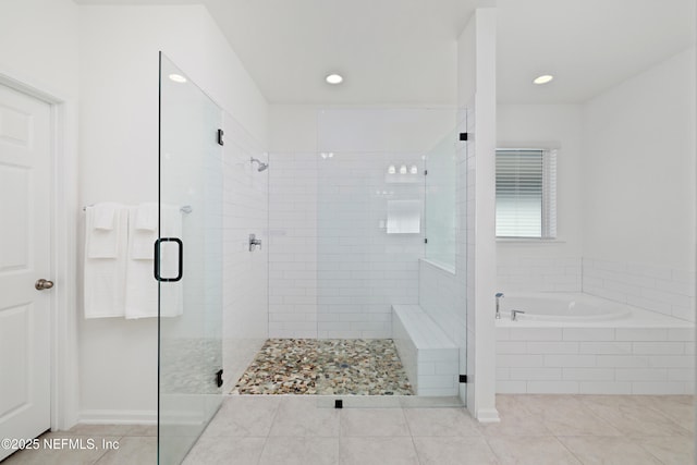 bathroom with a shower stall, a bath, recessed lighting, and tile patterned floors