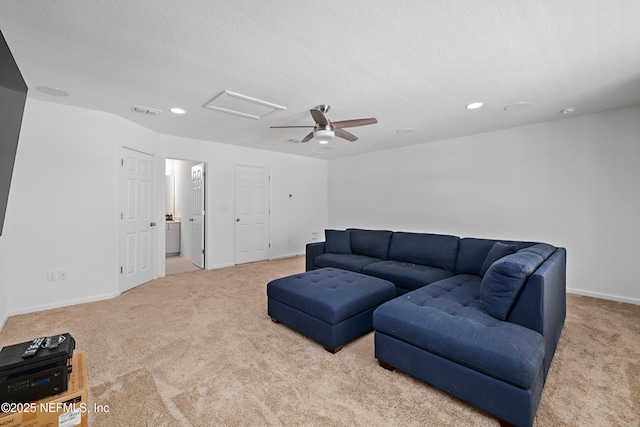 living room with baseboards, visible vents, attic access, recessed lighting, and carpet flooring