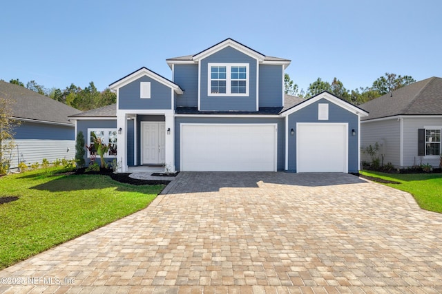 traditional home with decorative driveway and a front yard