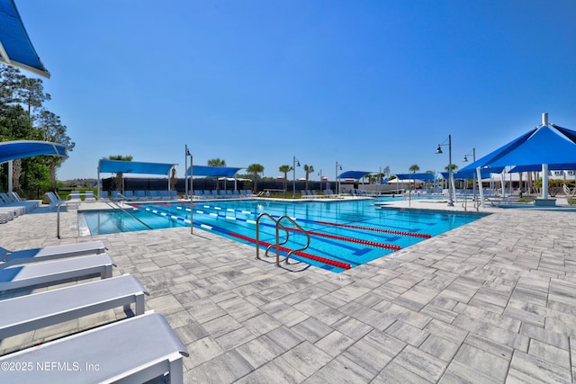 community pool featuring a patio area