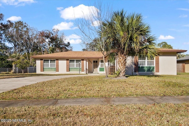 ranch-style house with a front yard