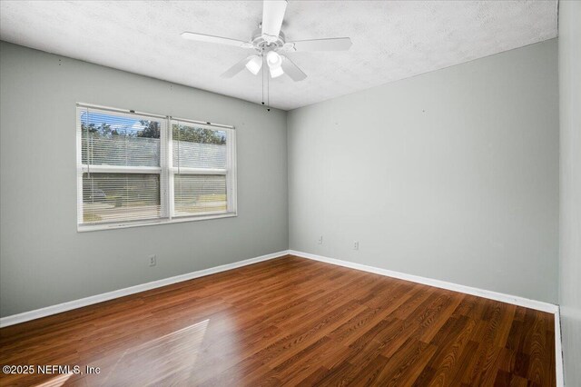 empty room featuring hardwood / wood-style floors, a textured ceiling, and ceiling fan