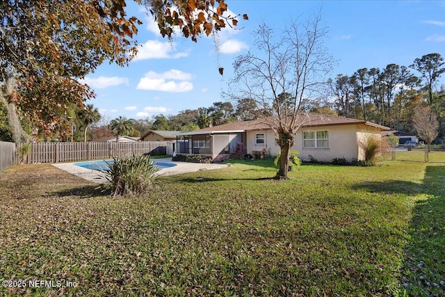 view of yard with a covered pool