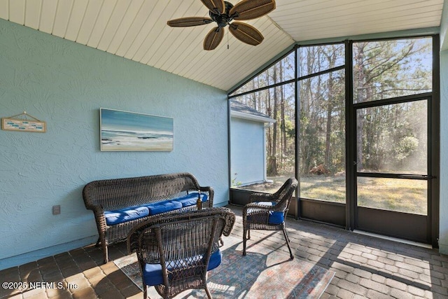 sunroom / solarium with ceiling fan, vaulted ceiling, and wooden ceiling