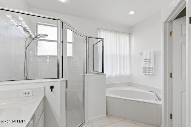 bathroom with vanity, independent shower and bath, and tile patterned flooring