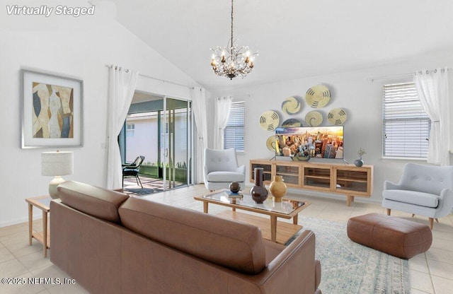 living room featuring lofted ceiling, a chandelier, and light tile patterned floors