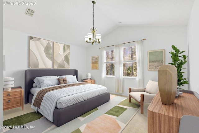 bedroom with carpet floors, a chandelier, and vaulted ceiling