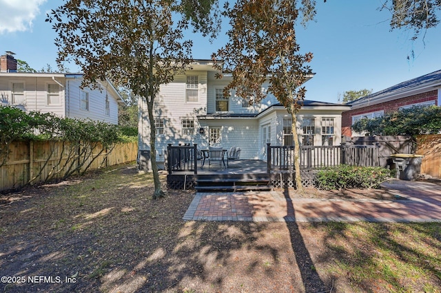 rear view of property with a deck