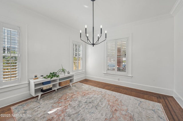 dining area with a notable chandelier, crown molding, and dark hardwood / wood-style floors