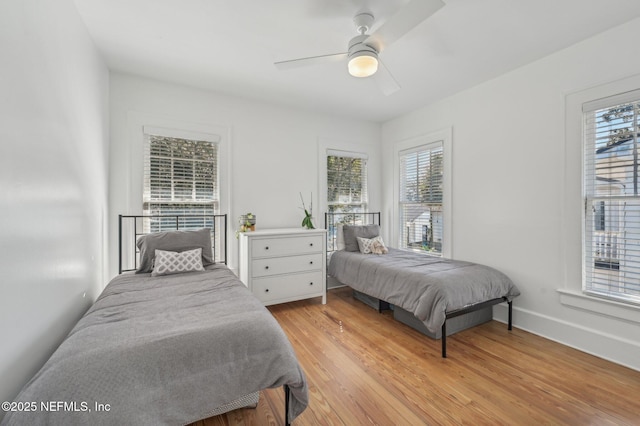 bedroom featuring ceiling fan and light hardwood / wood-style floors