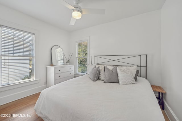 bedroom featuring hardwood / wood-style floors and ceiling fan