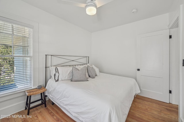 bedroom featuring ceiling fan and hardwood / wood-style floors