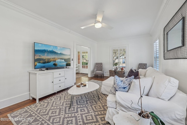 living room featuring crown molding, ceiling fan, and dark wood-type flooring