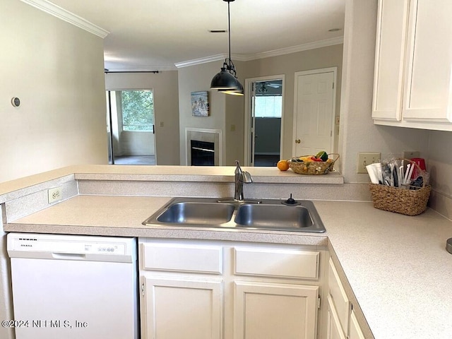 kitchen featuring white dishwasher, sink, ornamental molding, and white cabinets