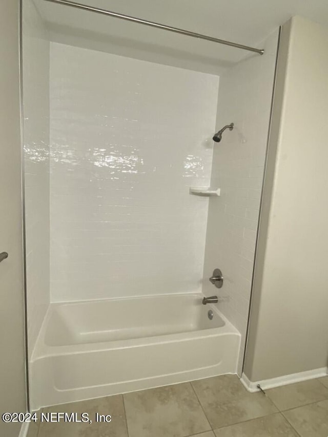 bathroom featuring tile patterned flooring and shower / bathing tub combination