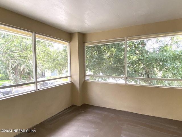 unfurnished sunroom featuring plenty of natural light