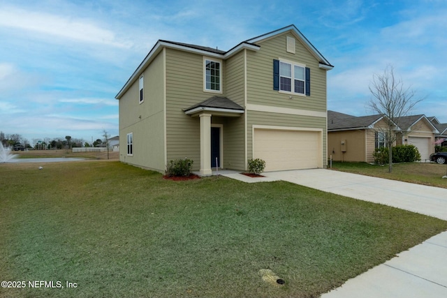 view of property with a garage and a front yard