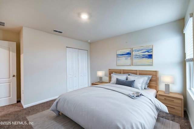 carpeted bedroom with a closet