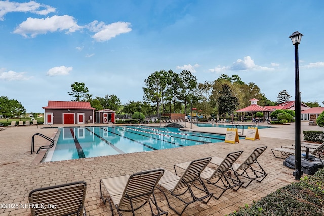 view of pool featuring a gazebo and a patio area