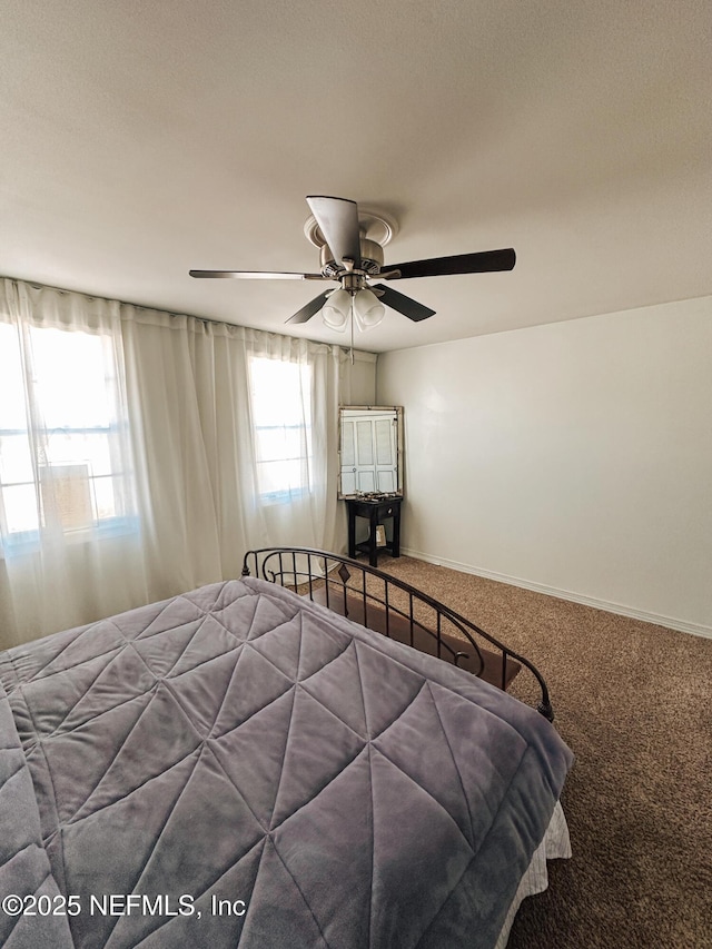 bedroom featuring carpet floors and ceiling fan