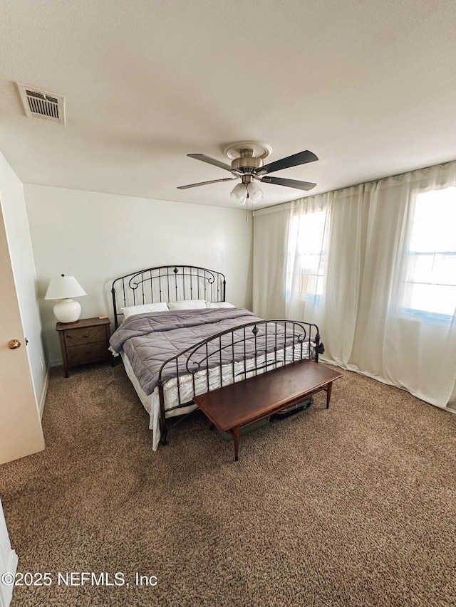 bedroom featuring ceiling fan and carpet floors