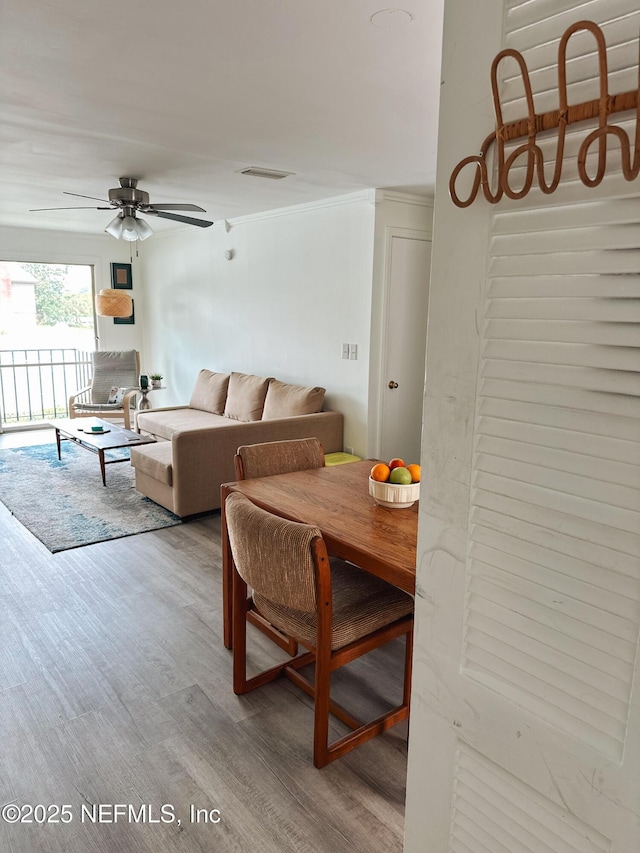 dining space featuring ceiling fan and light hardwood / wood-style flooring