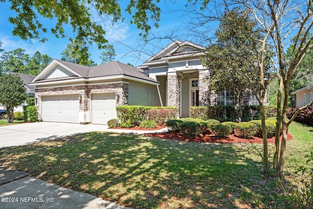 view of front facade featuring a garage and a front lawn