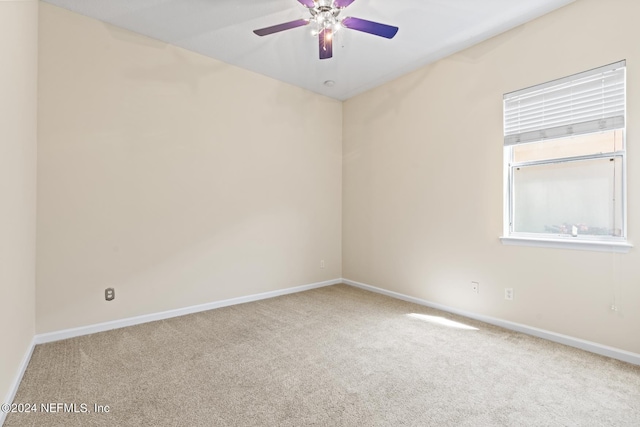 empty room featuring ceiling fan and carpet flooring