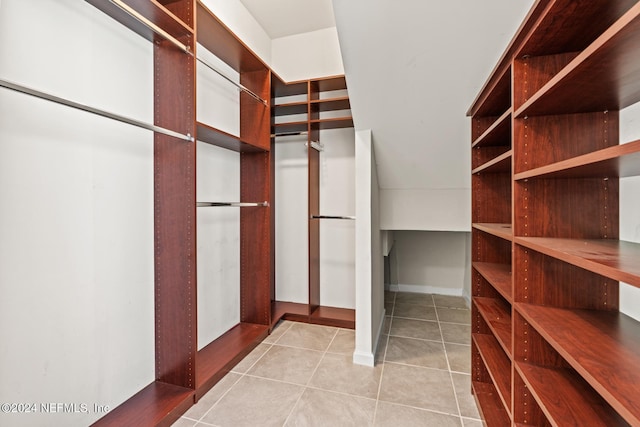 spacious closet with light tile patterned flooring