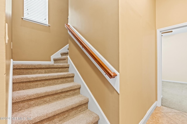 stairs featuring tile patterned floors