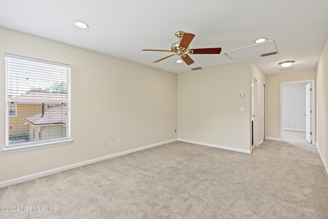 carpeted empty room with ceiling fan