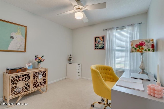 carpeted office featuring plenty of natural light, a textured ceiling, and ceiling fan