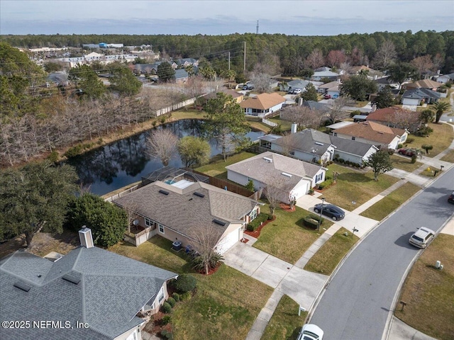 bird's eye view with a water view