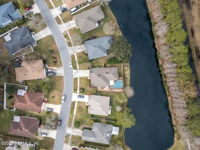 bird's eye view with a water view