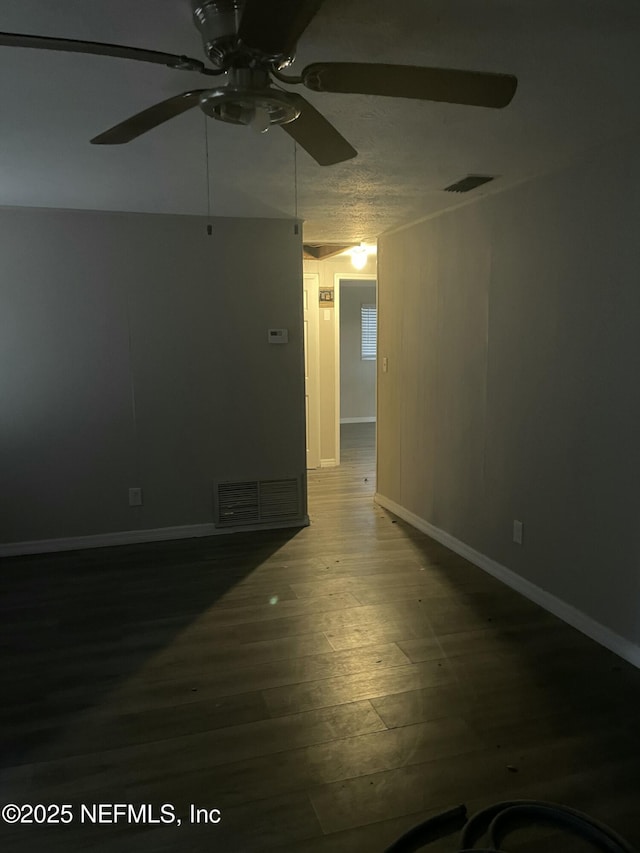 unfurnished room featuring ceiling fan and wood-type flooring