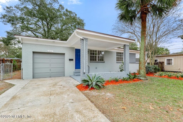 ranch-style house with a garage and a front yard