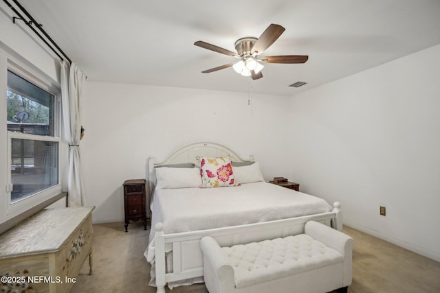 bedroom with light carpet and ceiling fan