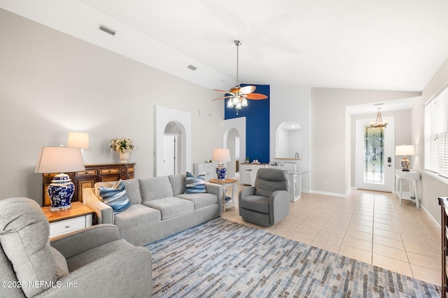 living room featuring light tile patterned flooring, high vaulted ceiling, and ceiling fan